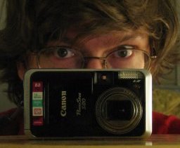 [Photo of Thomas behind the Canon Powershot S80]